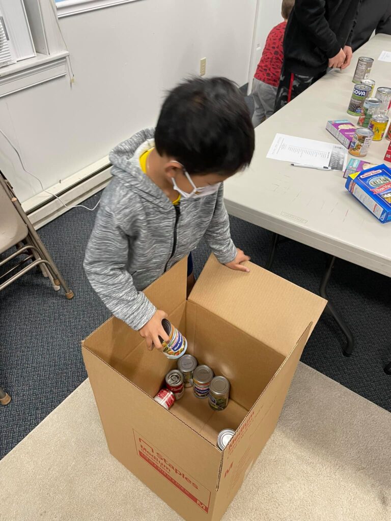 Fire Fly Kids Making Thanksgiving Food Boxes for Lazarus House!