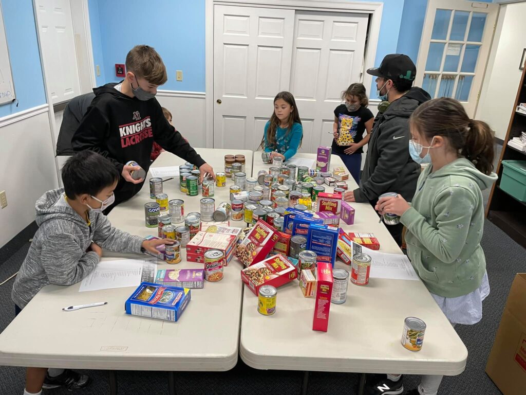 Fire Fly Kids Making Thanksgiving Food Boxes for Lazarus House!