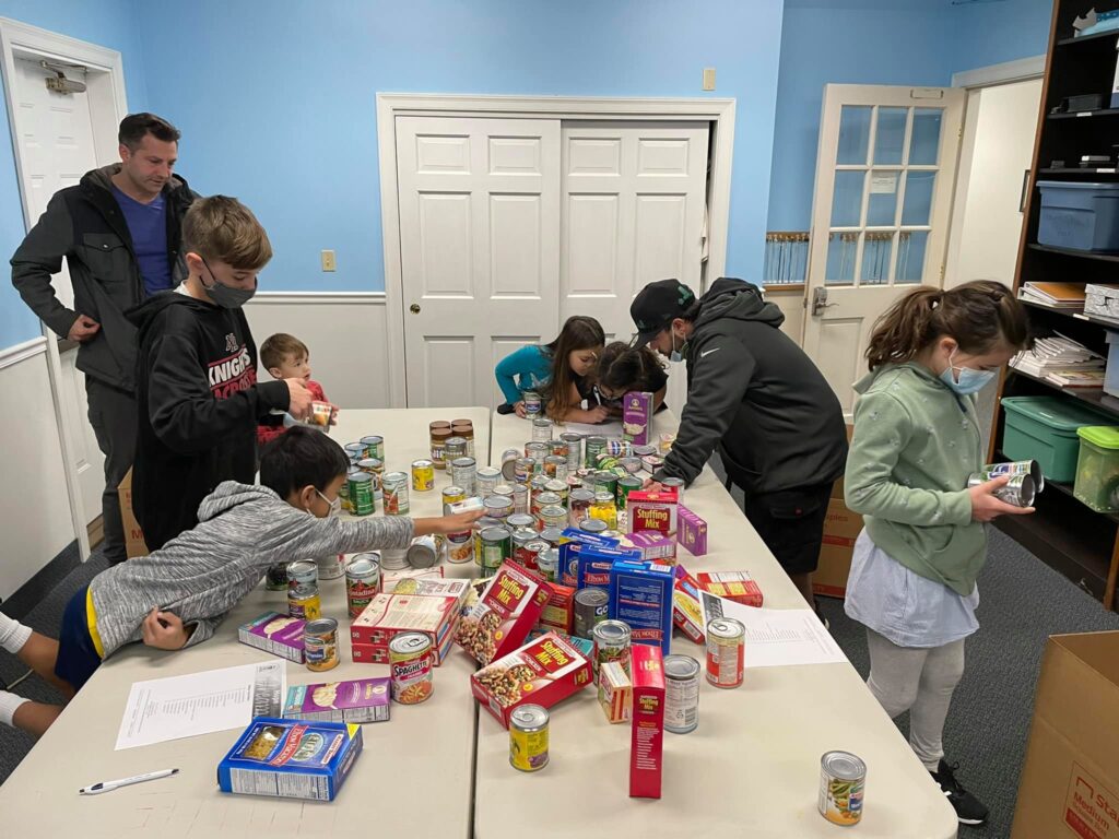 Fire Fly Kids Making Thanksgiving Food Boxes for Lazarus House!