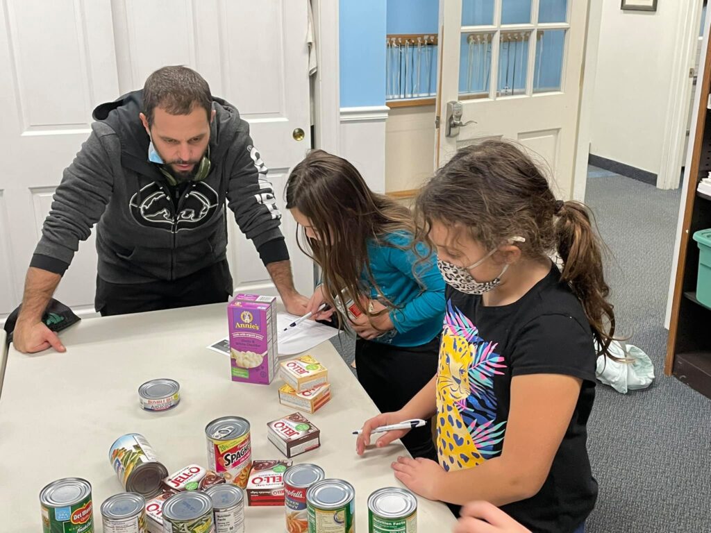 Fire Fly Kids Making Thanksgiving Food Boxes for Lazarus House!