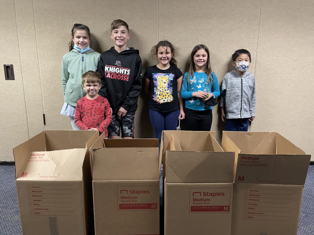 Fire Fly Kids Making Thanksgiving Food Boxes for Lazarus House!